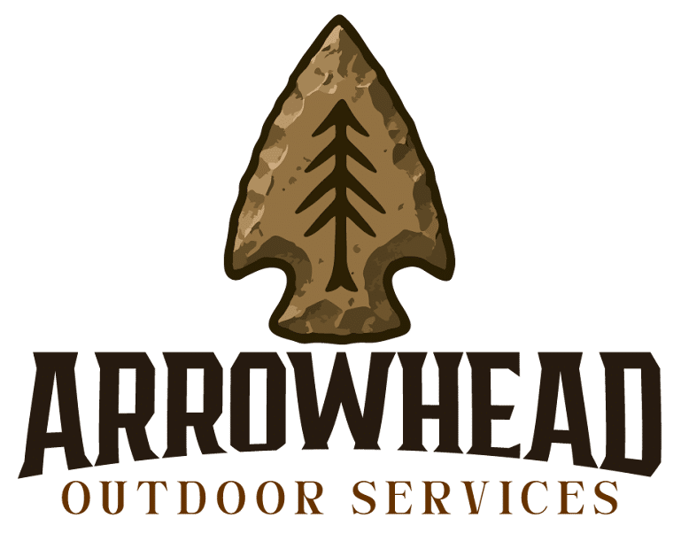 Logo for Arrowhead Outdoor Services featuring a tan stone arrowhead with a black pine tree icon and brown text below.