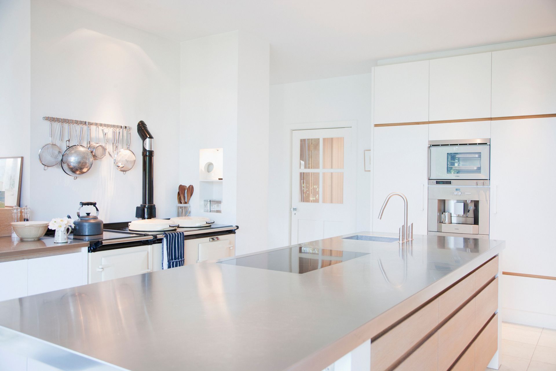 Contemporary kitchen featuring sleek countertops, representing professional kitchen remodeler work.