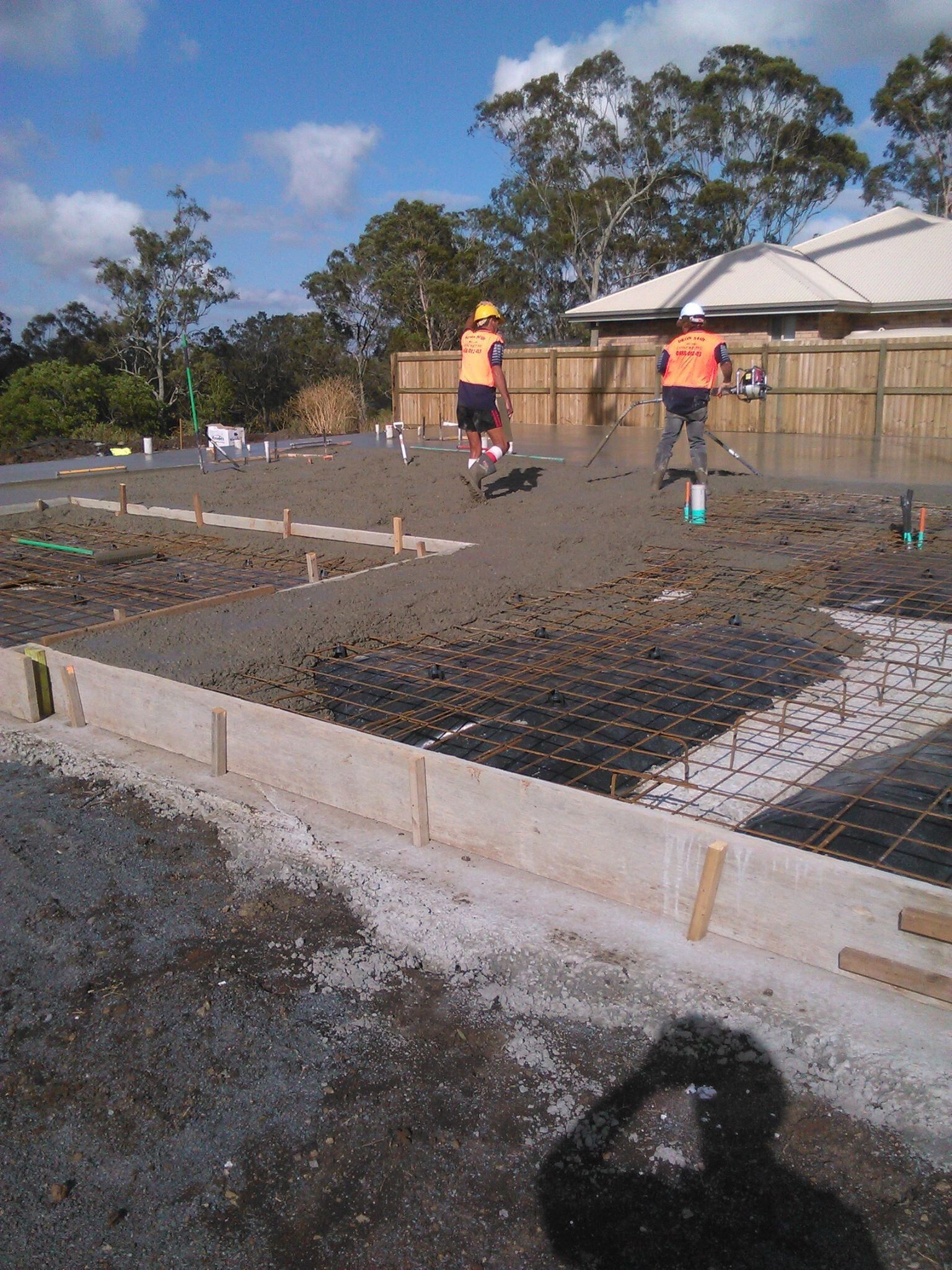 Workers installing decorative concrete