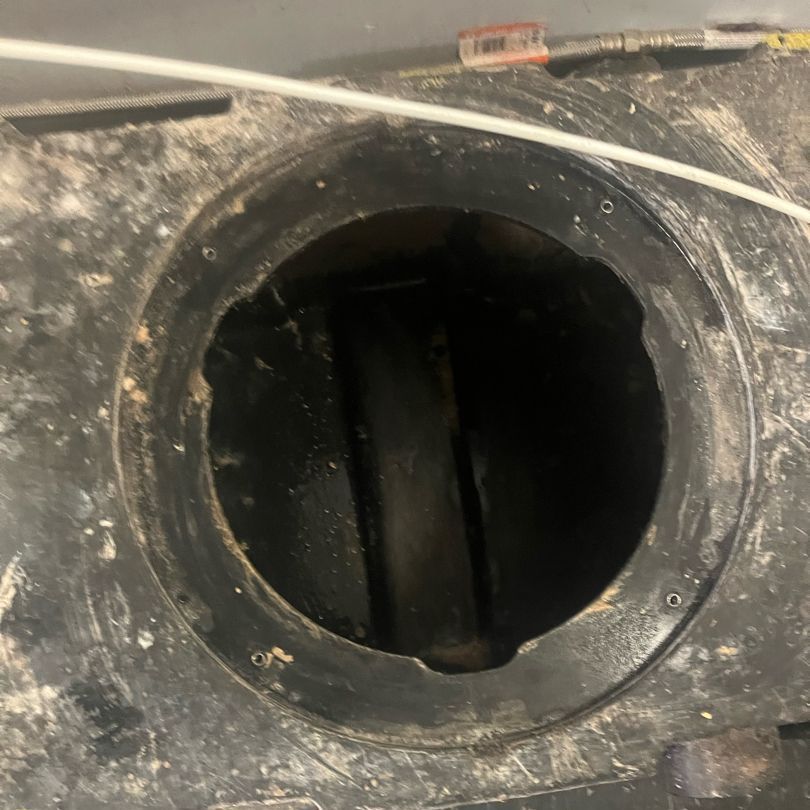 Black fuel tank opening with visible interior.