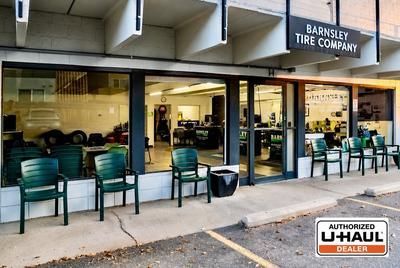 Barnsley Tire Company storefront with chairs outside and an Authorized U-Haul dealer sign