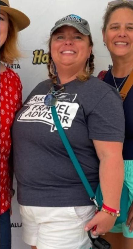 A woman wearing a shirt that says travel advisor