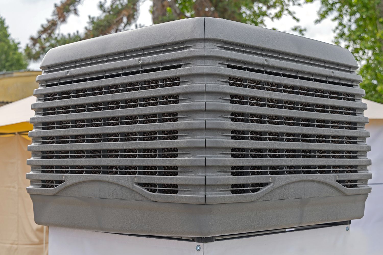 Close-up of an evaporative cooling unit used for efficient ventilation. Close-up of an evaporative cooling unit used for efficient ventilation.