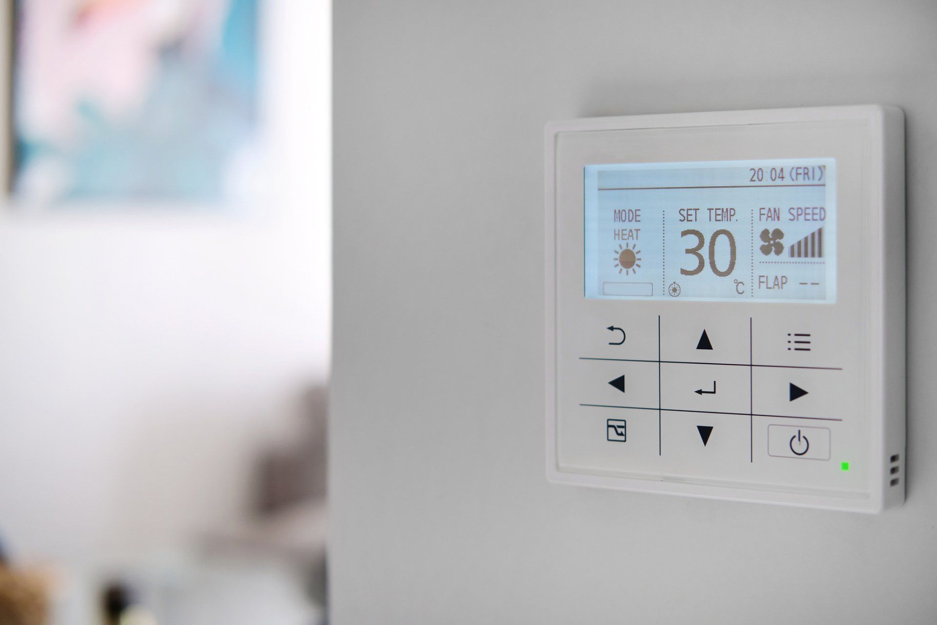 Woman Adjusts Thermostat - Melbourne - Airfixing Heating & Cooling
