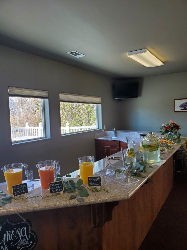 There are many different types of drinks on the counter.