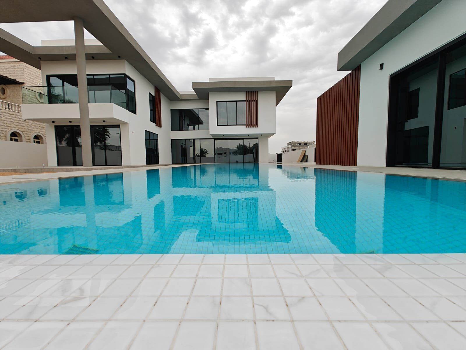 Modern luxury villa exterior in Dubai with contemporary architecture and premium landscaping designed by Concept Art Decor