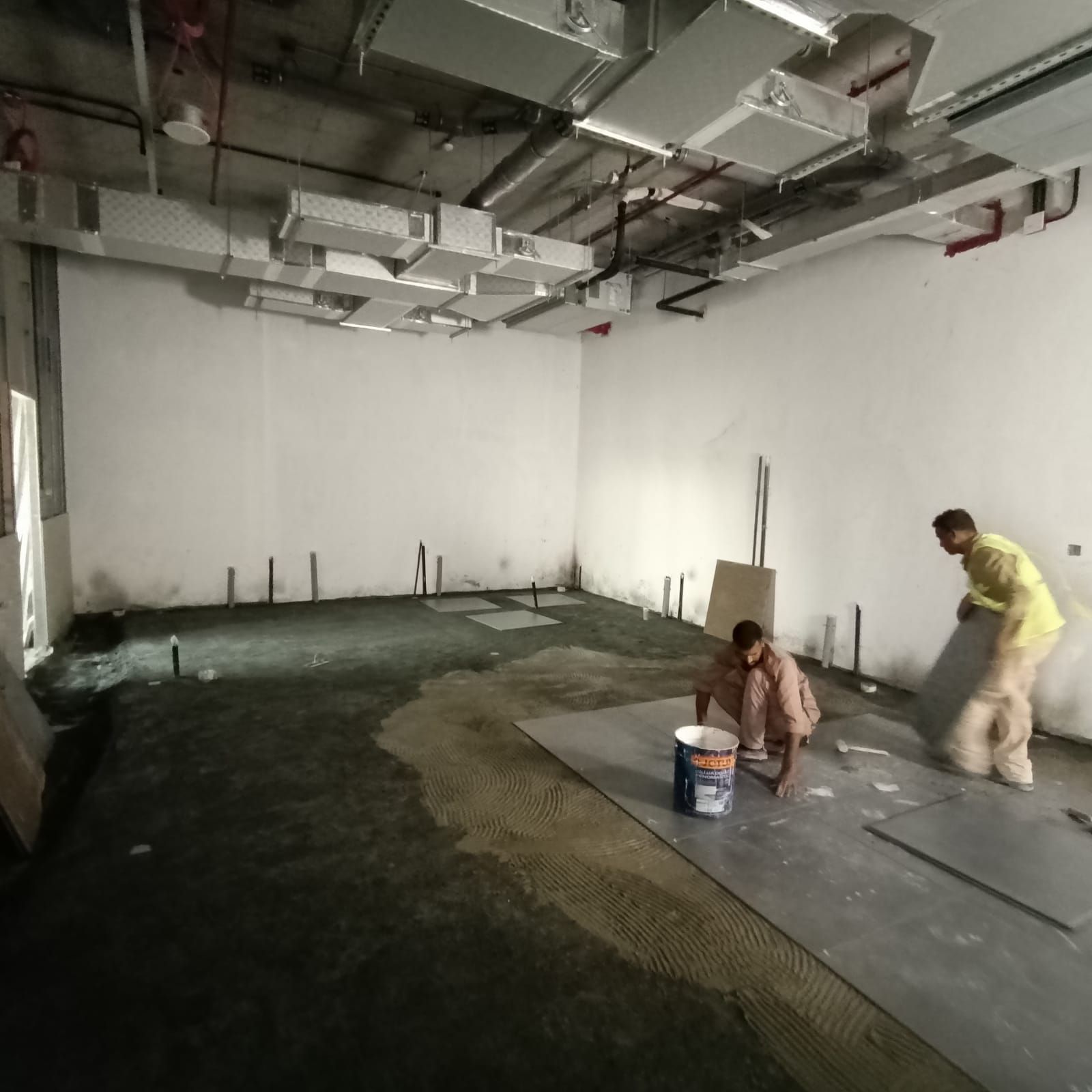 Commercial interior flooring installation Dubai office fit-out construction stage