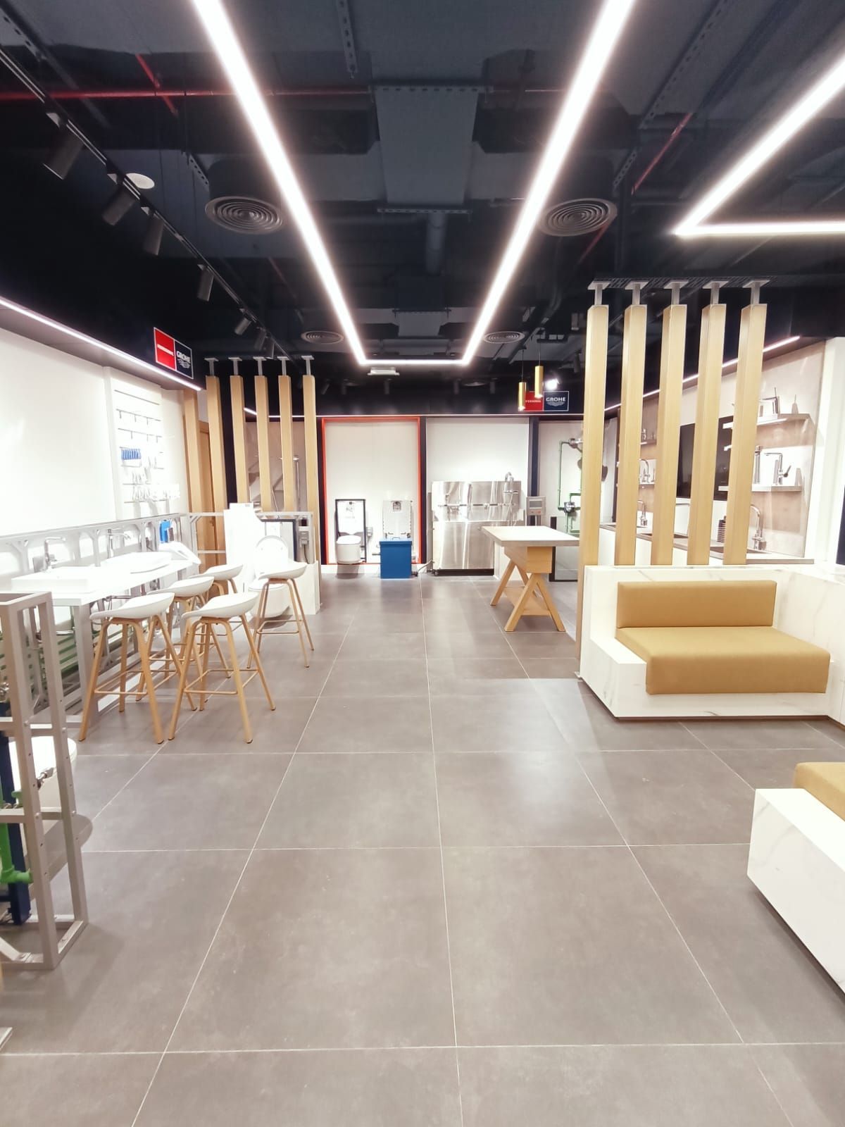 Contemporary commercial showroom Dubai completed fit-out with seating and lighting