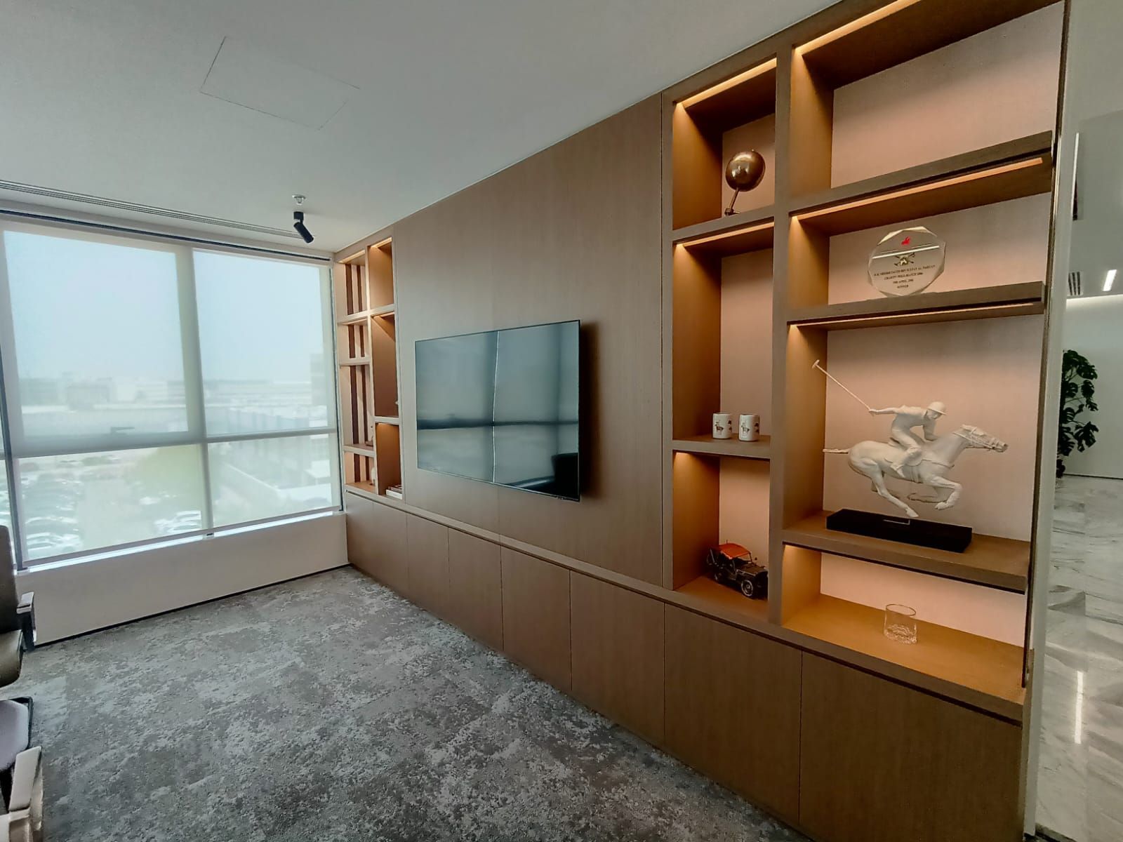 Executive office interior with custom shelving Dubai corporate workspace design
