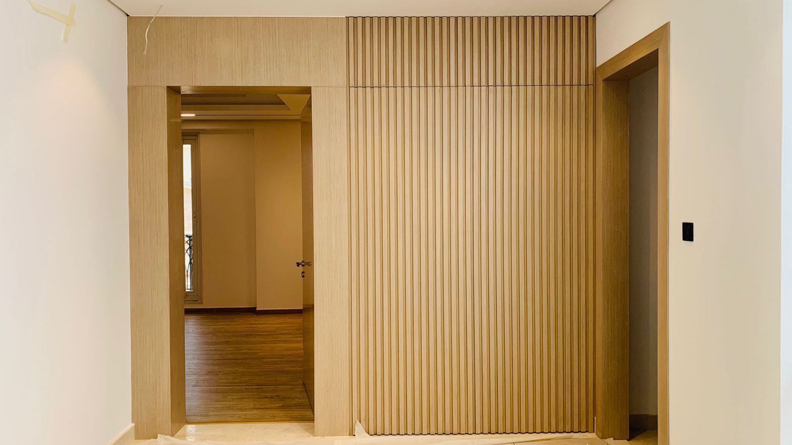 Bespoke wood slat wall paneling Palm Jumeirah luxury villa Dubai by Concept Art Decor