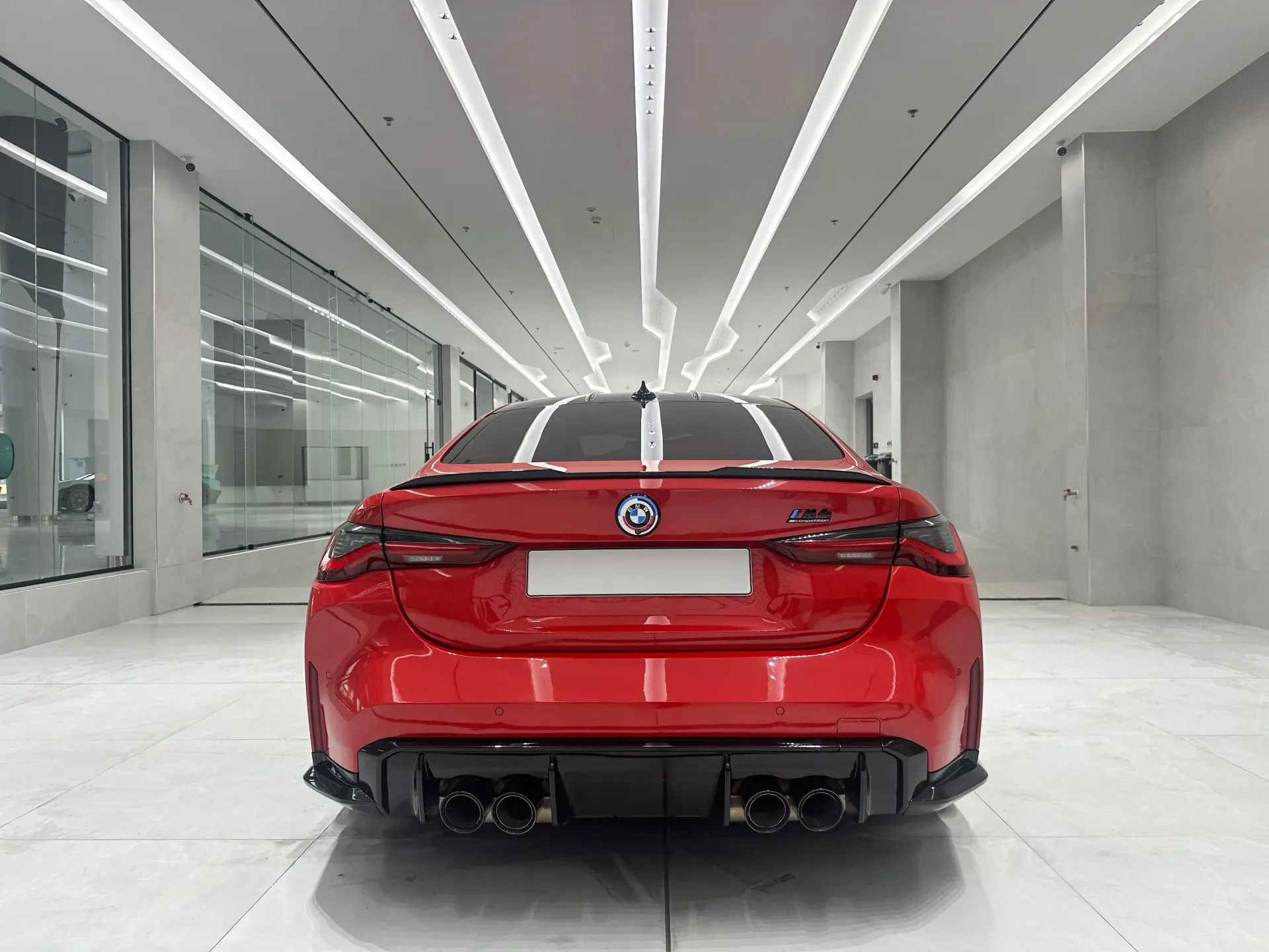 Vehicle service or wash bay area inside a Dubai luxury car showroom fit-out with heavy-duty finishes by Concept Art Decor