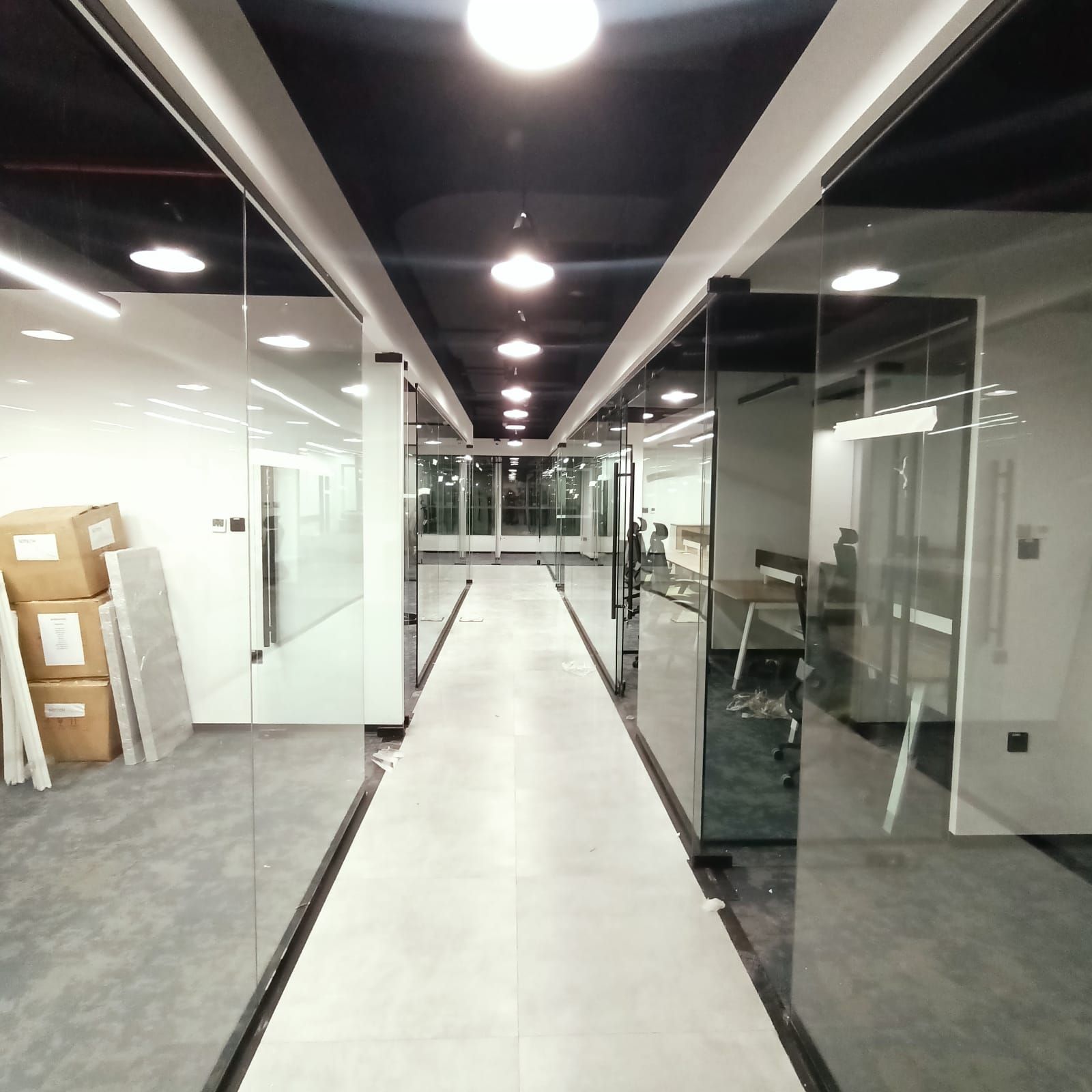 Glass-partition office corridor Dubai modern commercial interior design