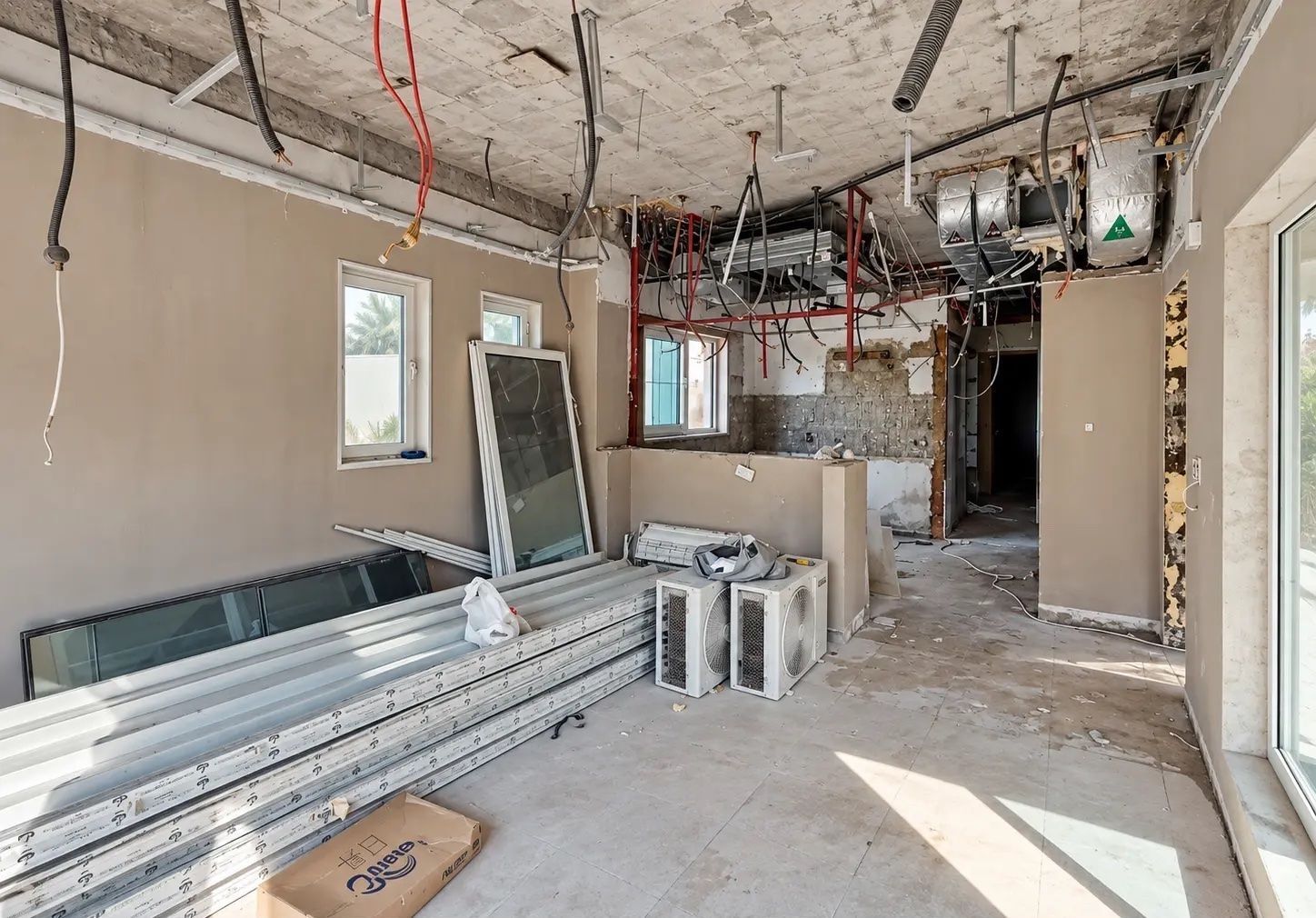 Jumeirah Park villa renovation in Dubai showing exposed MEP, electrical and air-conditioning systems during strip-out