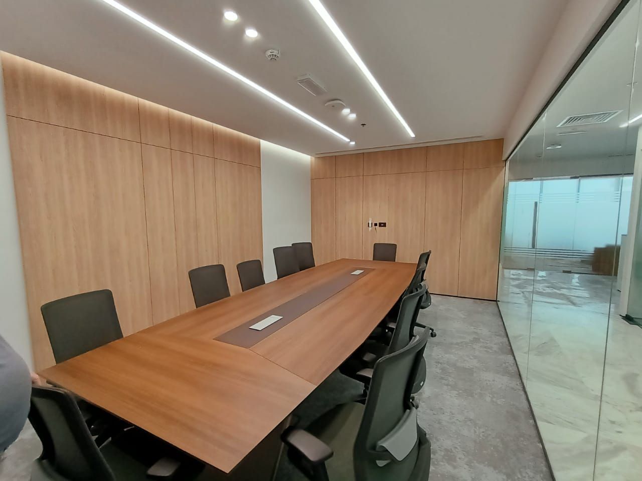 Corporate meeting room interior Dubai wood panel conference space fit-out