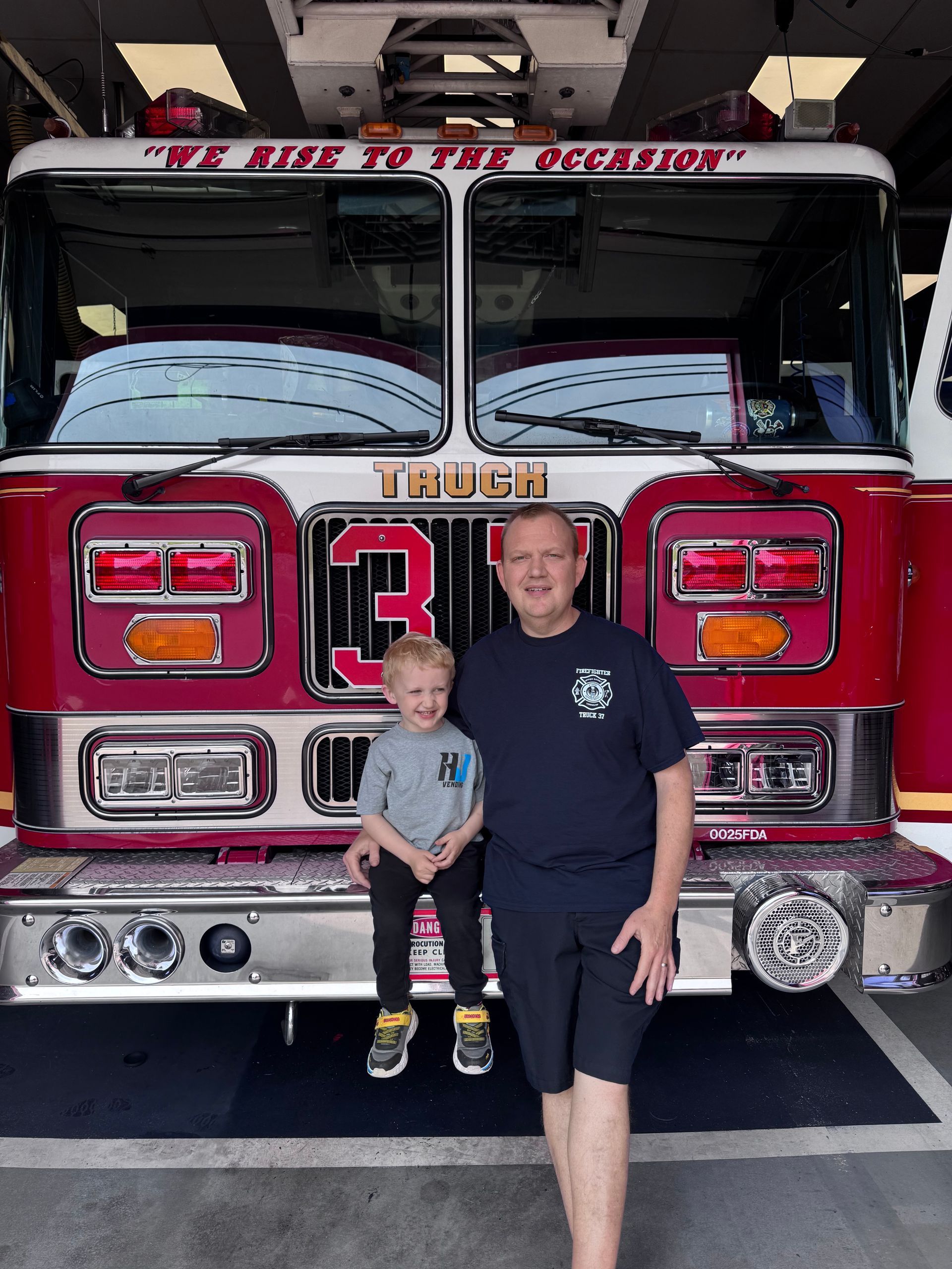 HJ Vending co-owner Matt with his son in front of an Upper Darby fire truck