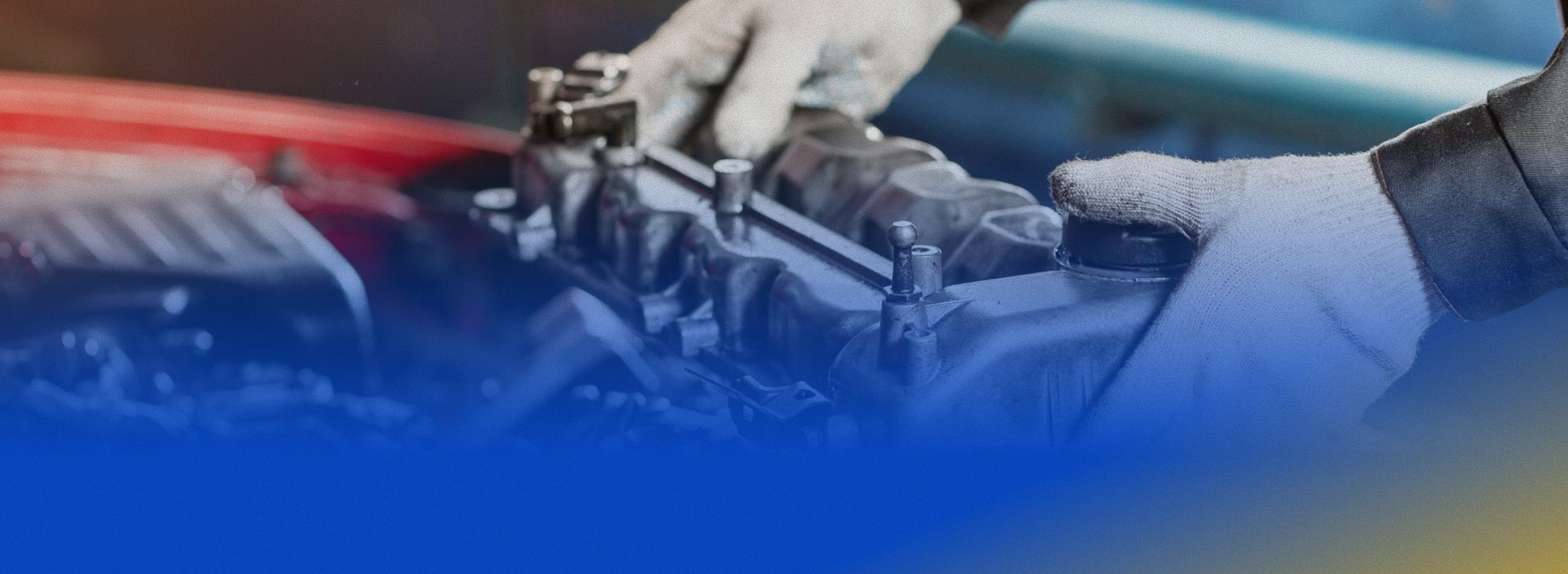 Hands working on a motorcycle engine, with blue and red motion blur background | One Stop Auto Service