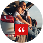 Couple sitting beside a white car with a red quote icon overlay | One Stop Auto Service