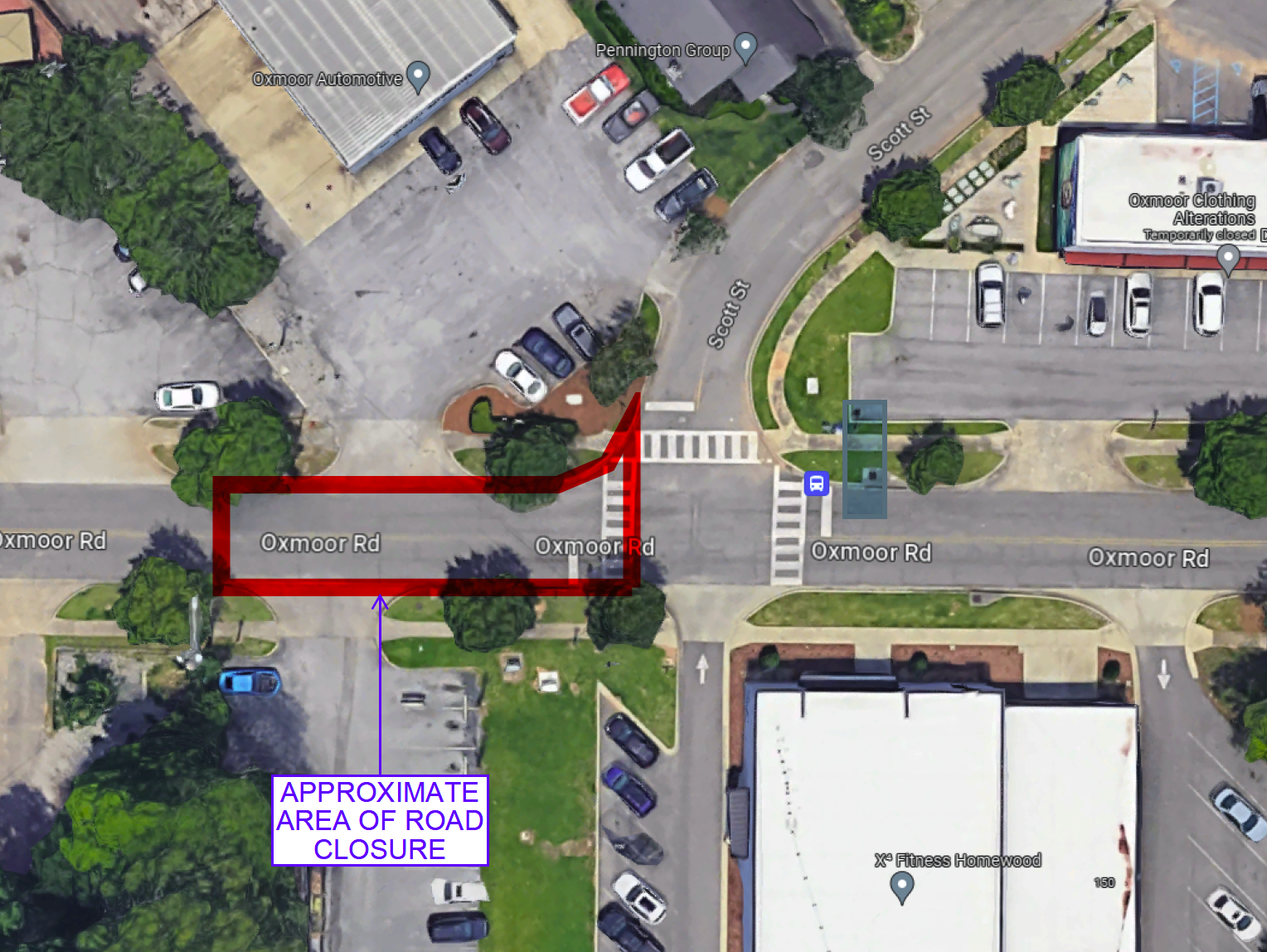 An aerial view of a parking lot with a sign that says approximate area of road closure