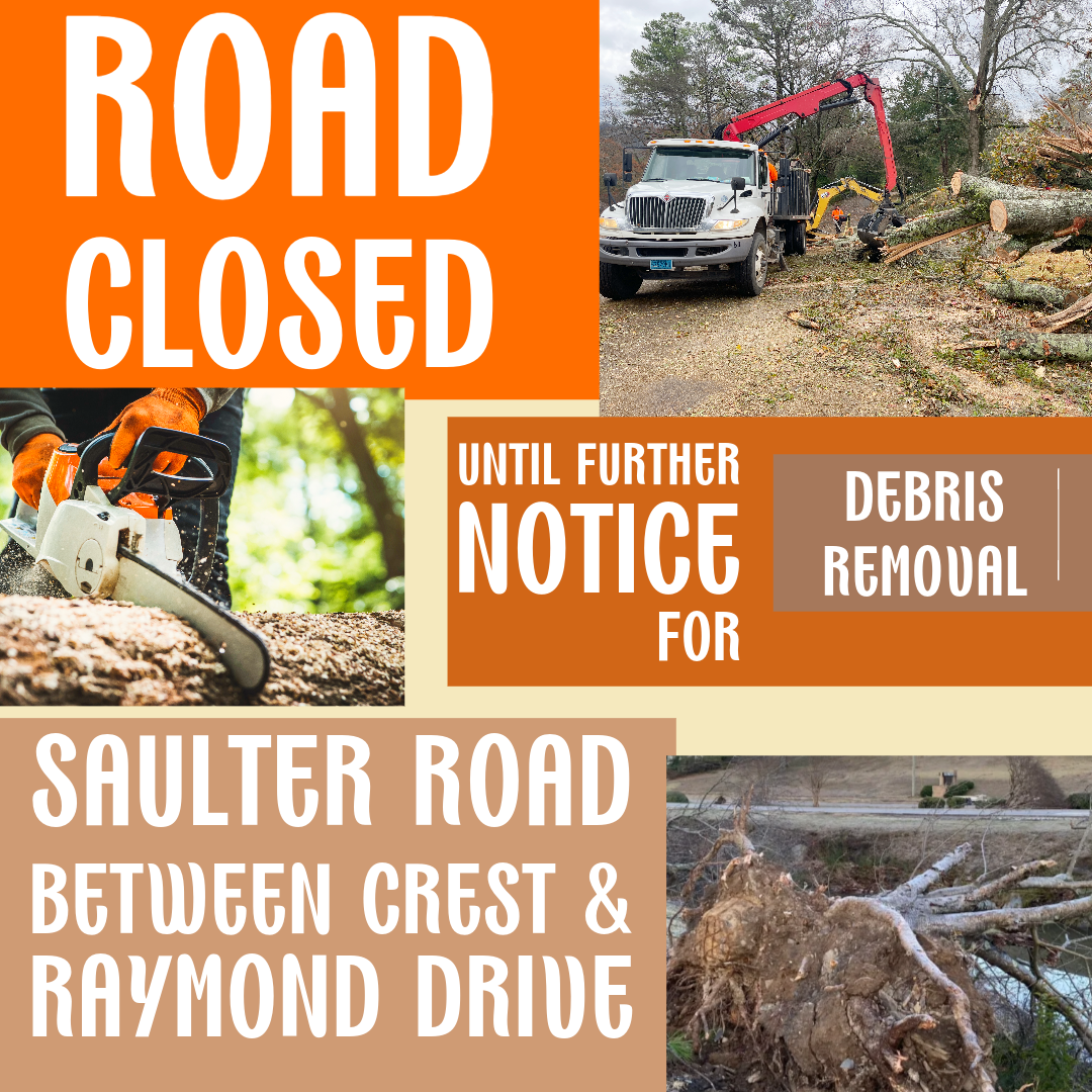 A sign that says road closed between crest and raymond drive