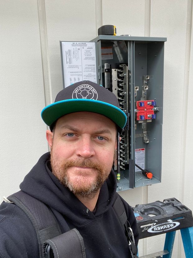 The Electric Pro - Local electrician from The Electric Pro standing beside branded service vehicle in Santa Rosa, CA