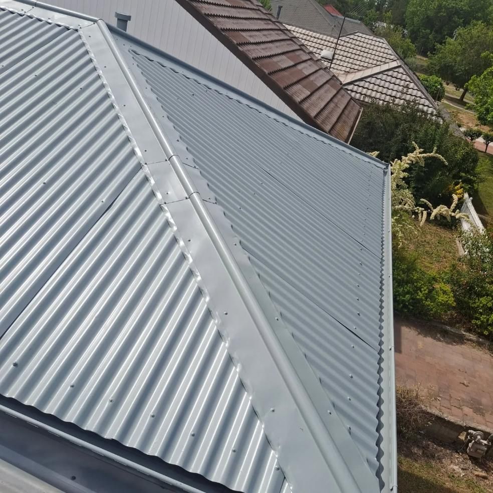 An Aerial View Of A House With A Metal Roof — Roofworx Group In Bathurst, NSW