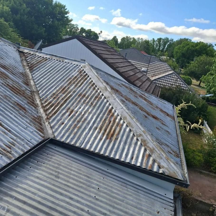 An aerial view of a rusty metal roof — Roofworx Group In Lithgow, NSW