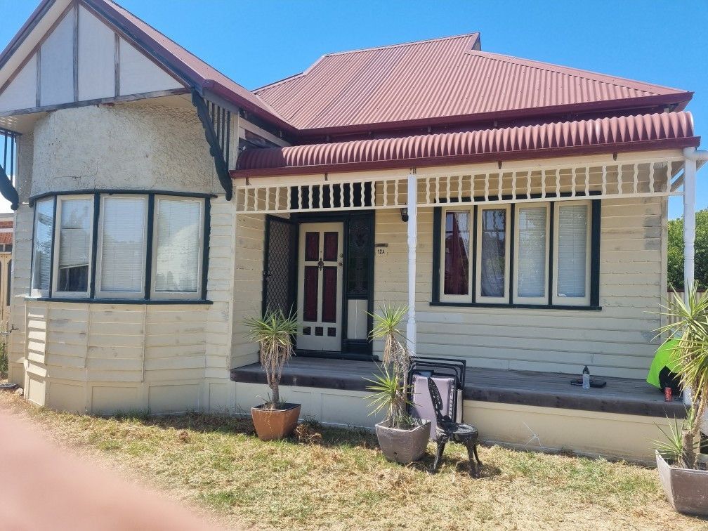 A white house with a red roof and a porch — Recoat Painting In West Wodonga, VIC