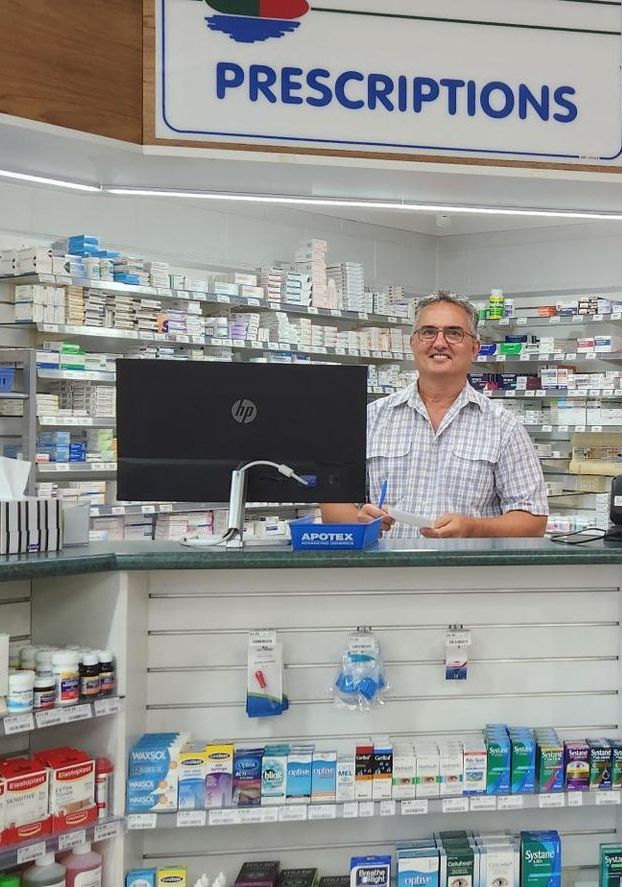 Man Standing Behind The Counter
At The Pharmacy— Bluewater Pharmacy in Yabulu, QLD