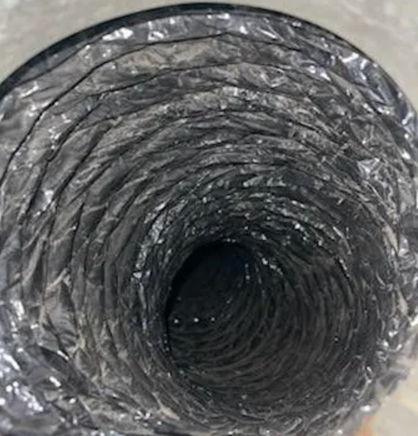 Flexible, metallic silver HVAC ductwork interior.