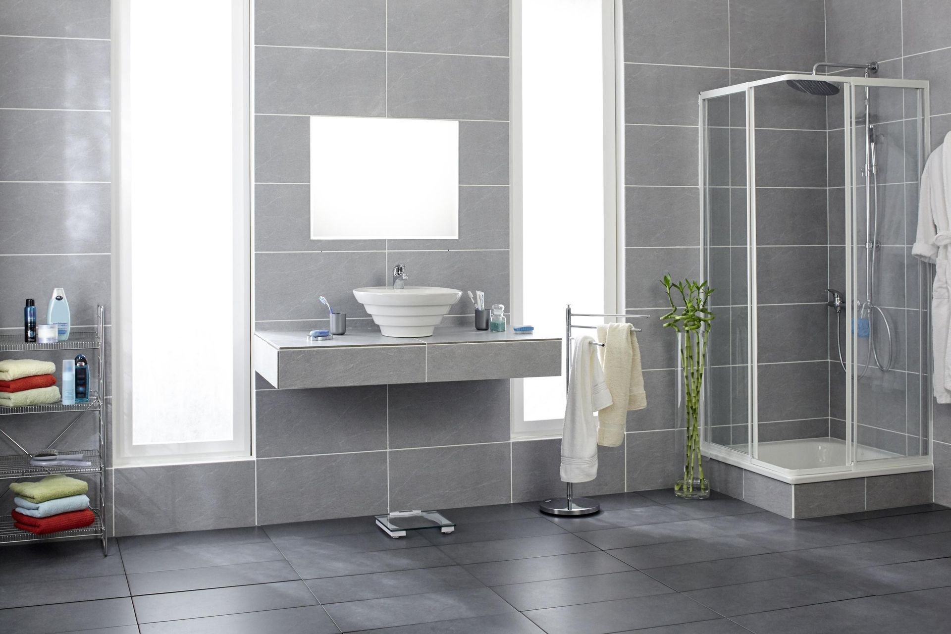 a bathroom with a sink a mirror and a shower