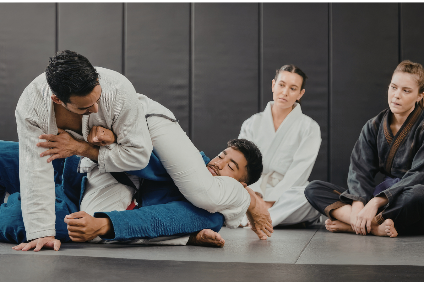 Adults practicing grappling drills at Almighty Jiu-Jitsu in Huntington Beach, CA.
