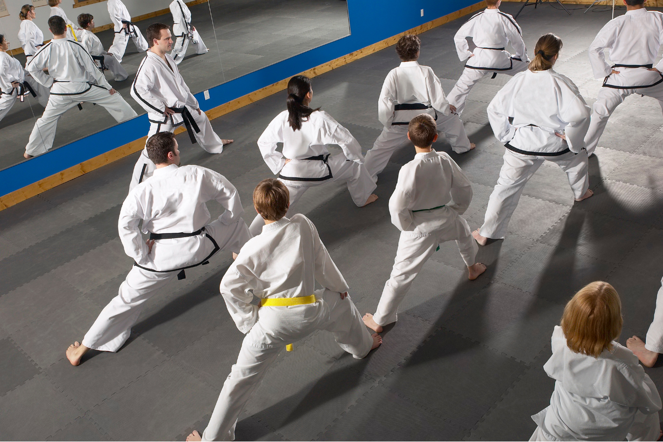 Adults drilling Jiu-Jitsu scrambles at Almighty Jiu-Jitsu in Huntington Beach, CA to build agility.