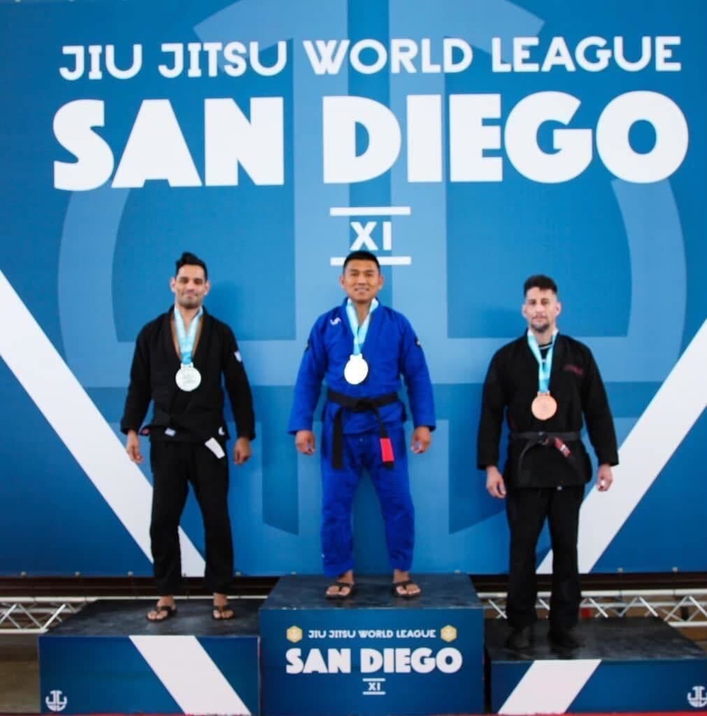 Adult students practicing controlled Jiu-Jitsu sparring at Almighty Jiu-Jitsu in Huntington Beach.