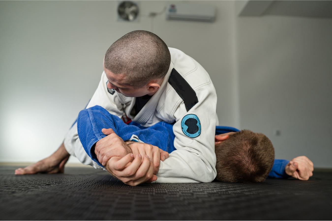 Adults drilling Brazilian Jiu-Jitsu technique at Almighty Jiu-Jitsu in Huntington Beach, CA.