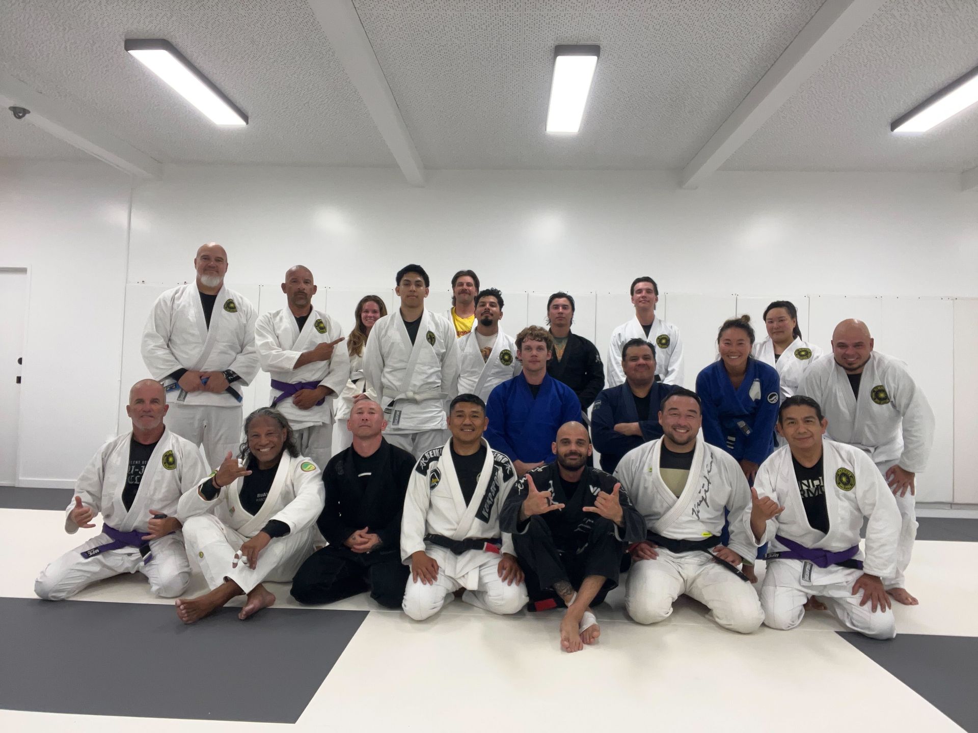 Adult students practicing controlled grappling at Almighty Jiu-Jitsu in Huntington Beach, CA.