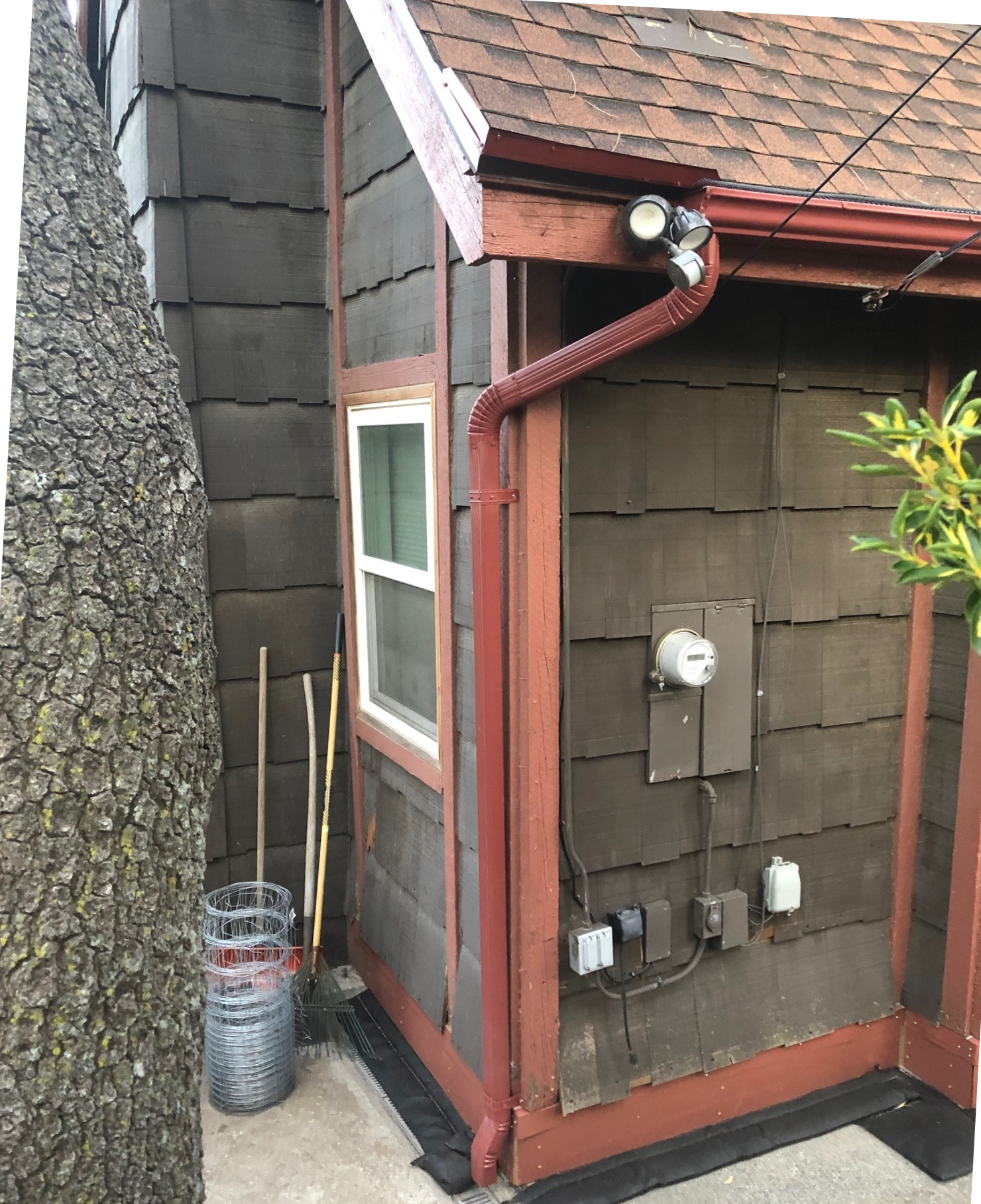 A house with a gutter on the side of it