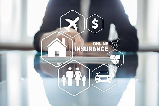 A person is using a tablet with a screen showing online insurance.