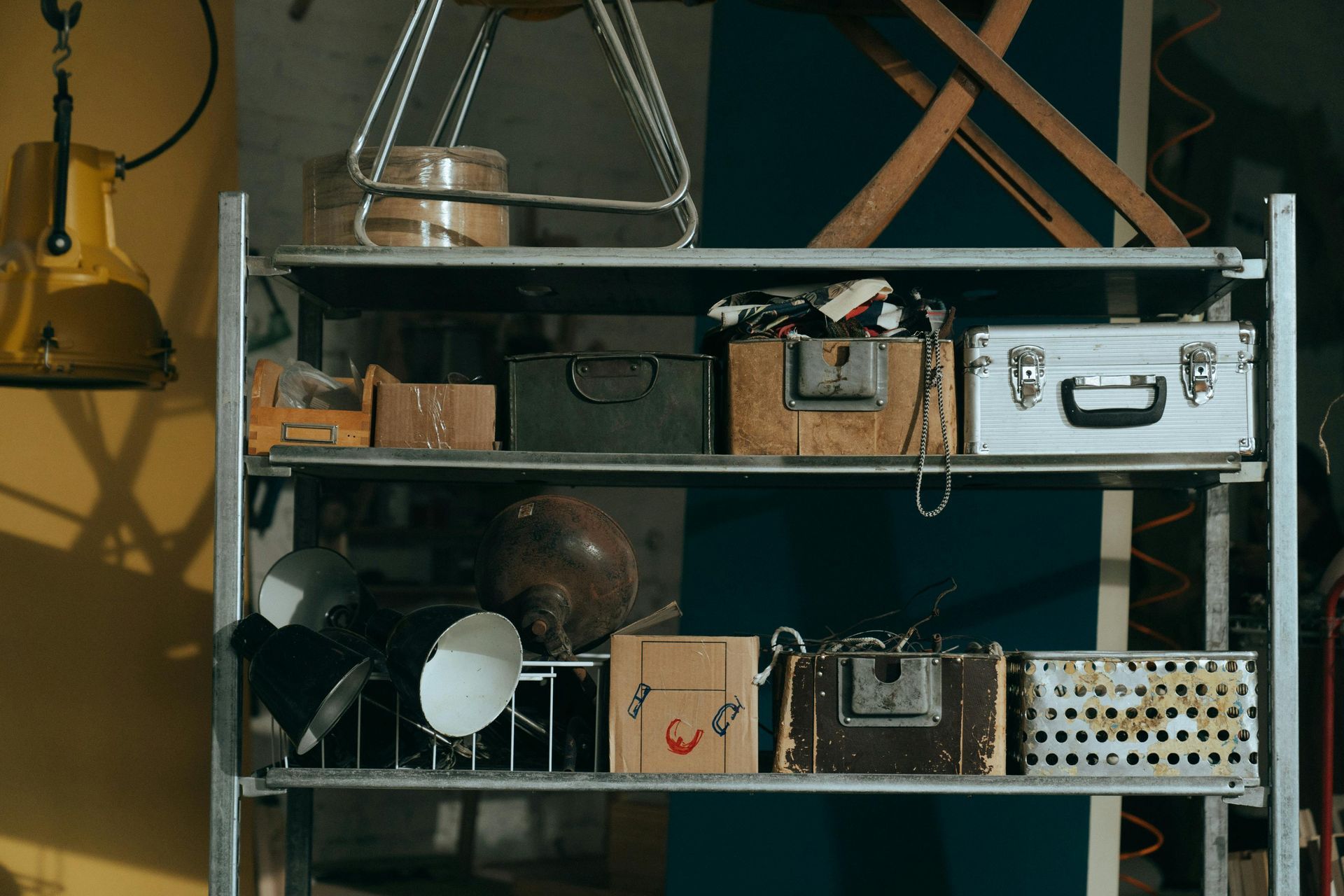 Cluttered storage shelf with boxes