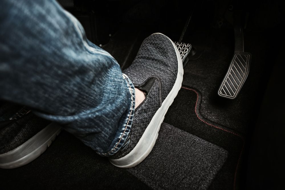 A Person is Pressing the Brake Pedal in a Car — Mechanical World In Wagga Wagga, NSW