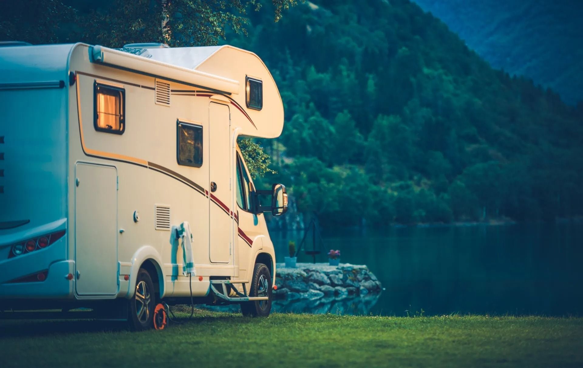 A White Rv is Parked Next to a lake — Mechanical World In Wagga Wagga, NSW