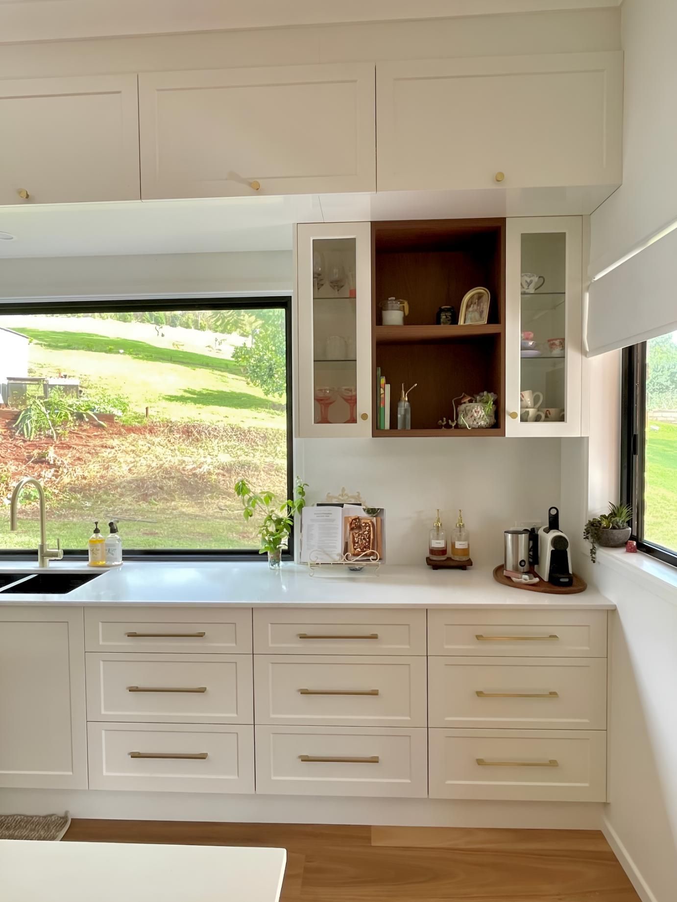 A Kitchen With White Cabinets, a Sink, and a Window — BM Cabinetry In Spring Grove, NSW