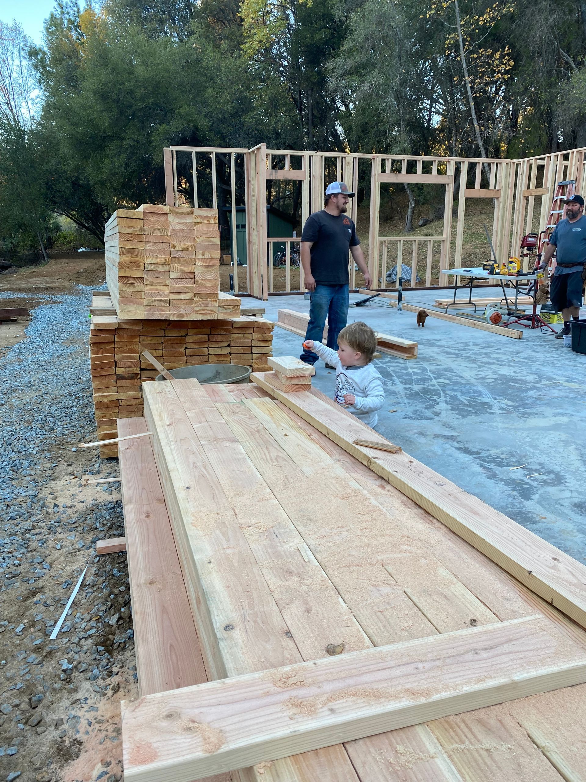 kids playing with the lumber pile.