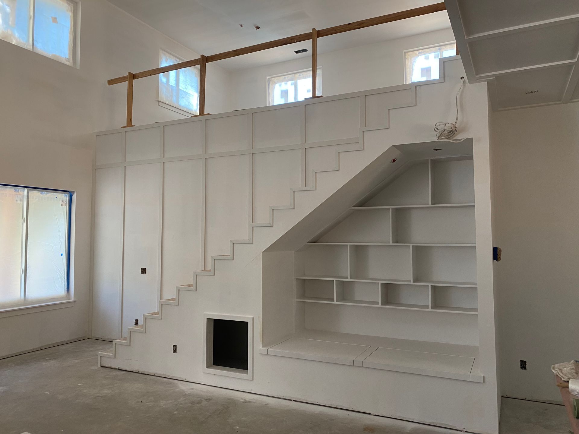 custom cabinets under stairs.