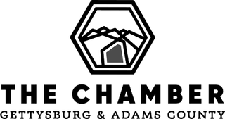 A black and white logo for the chamber of commerce in gettsburg and adams county.