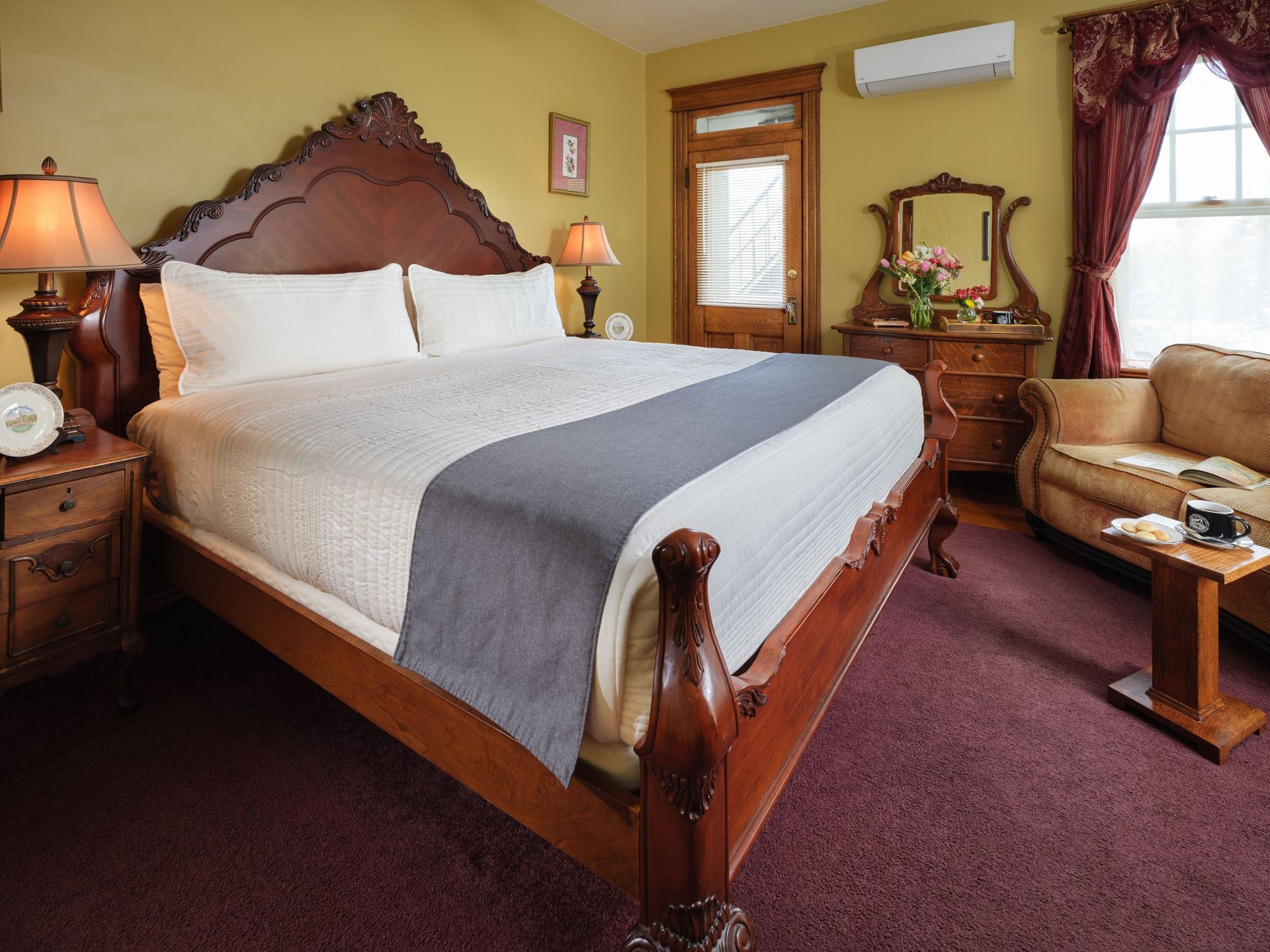 A bedroom with a king size bed and a couch