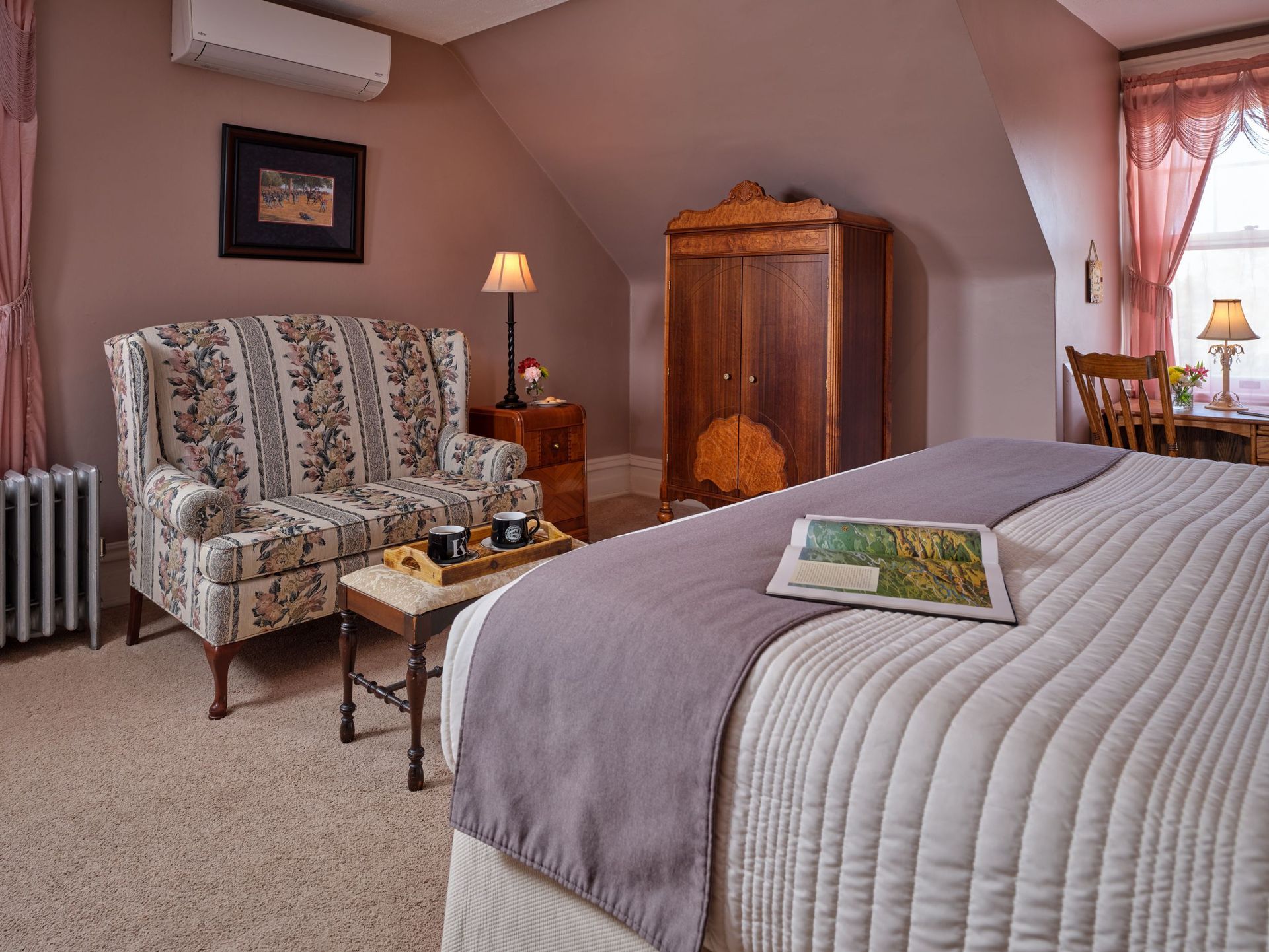 A bedroom with a king size bed and a couch