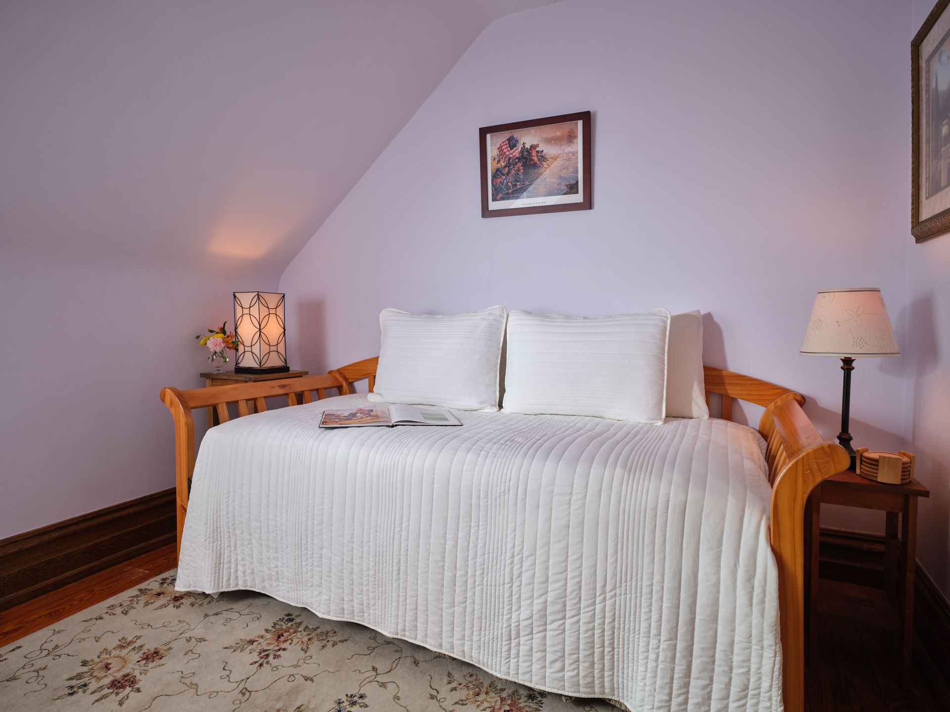 A day bed in a bedroom with purple walls
