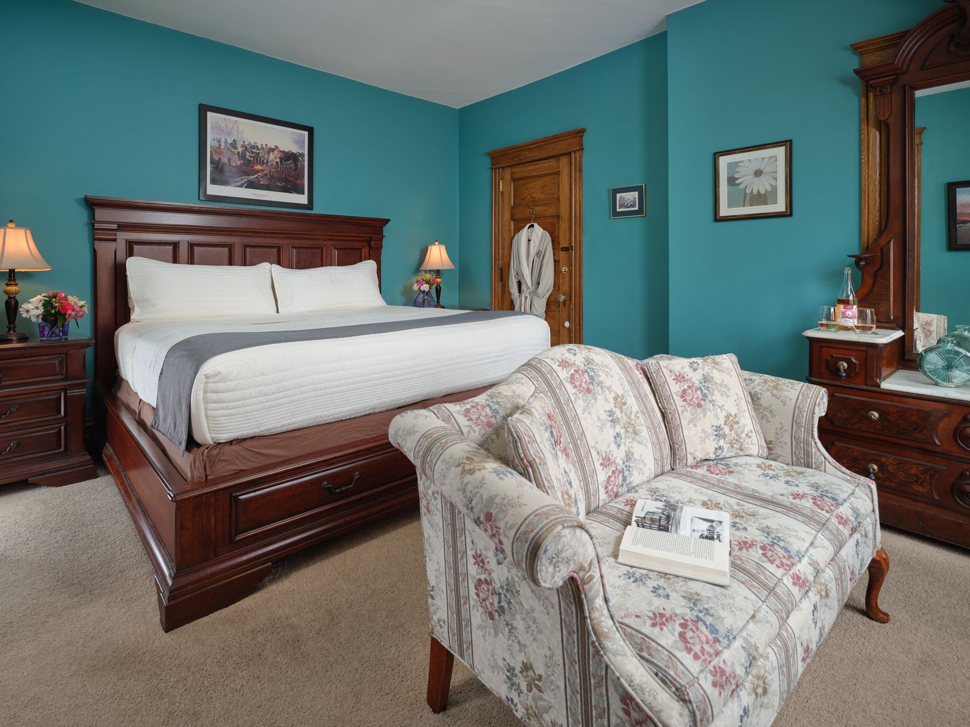 A bedroom with a king size bed and a couch