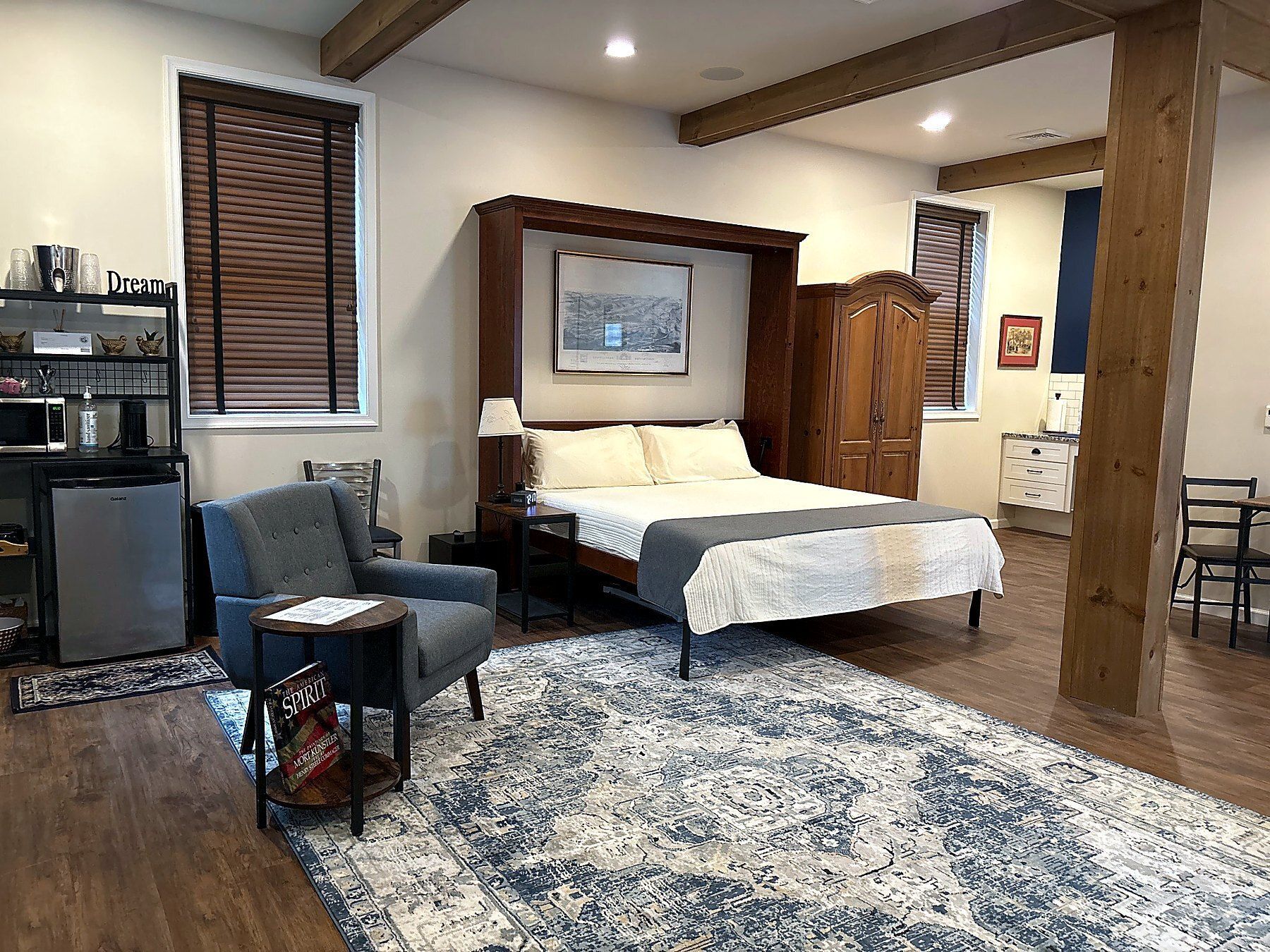 A bedroom with a king size bed and a couch