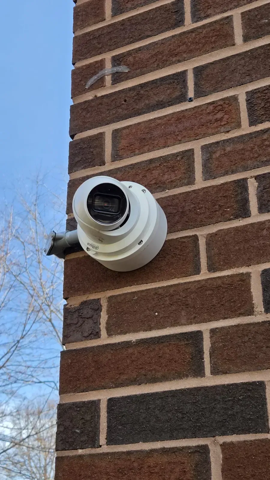 Security camera on Toronto home stucco wall